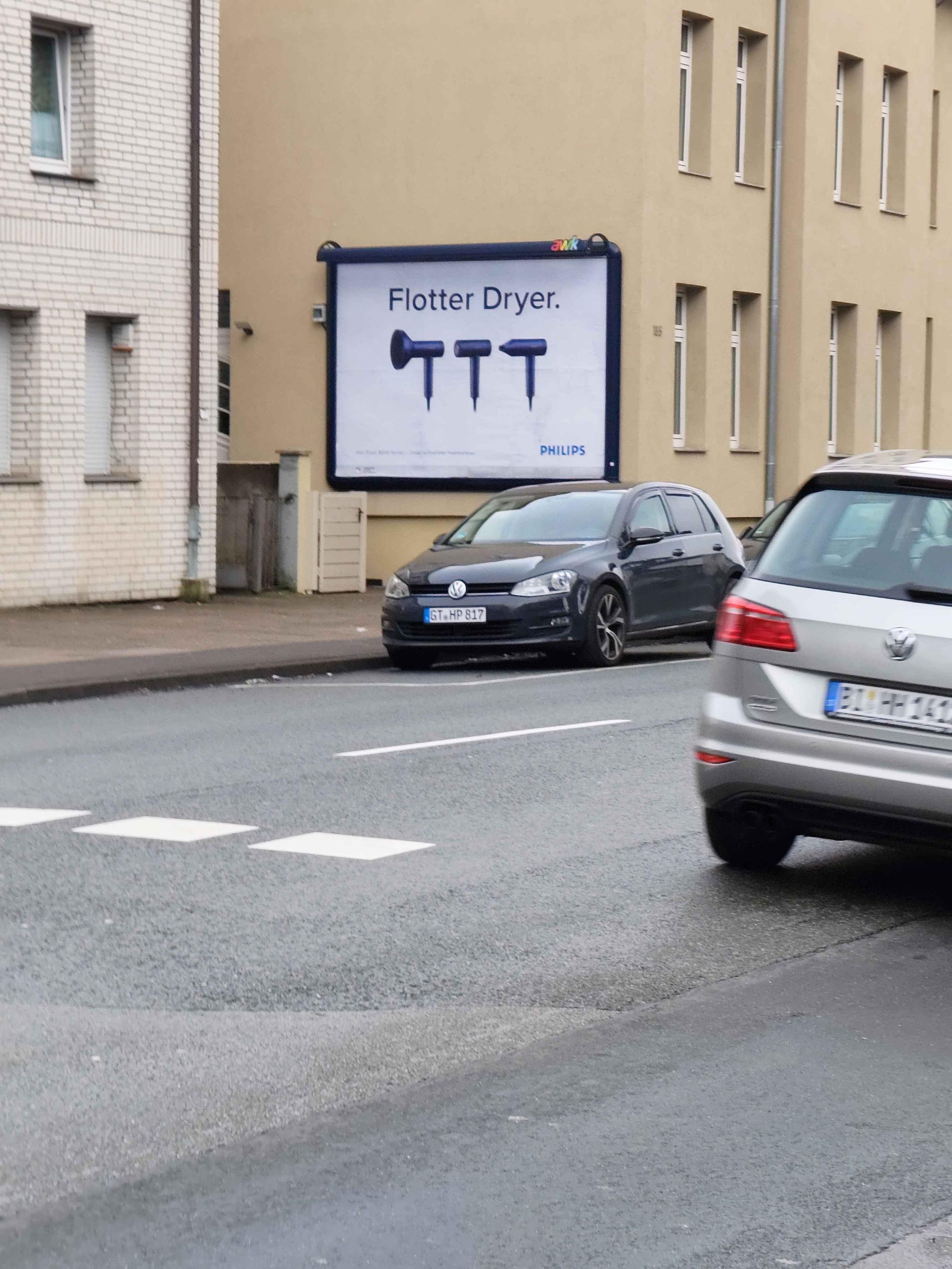 A Philips ad showing three hair dryers and the text "Flotter Dryer" which sounds like the German "flotter Dreier" which means threesome.